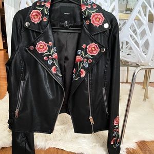Embroidered faux leather moto jacket.
